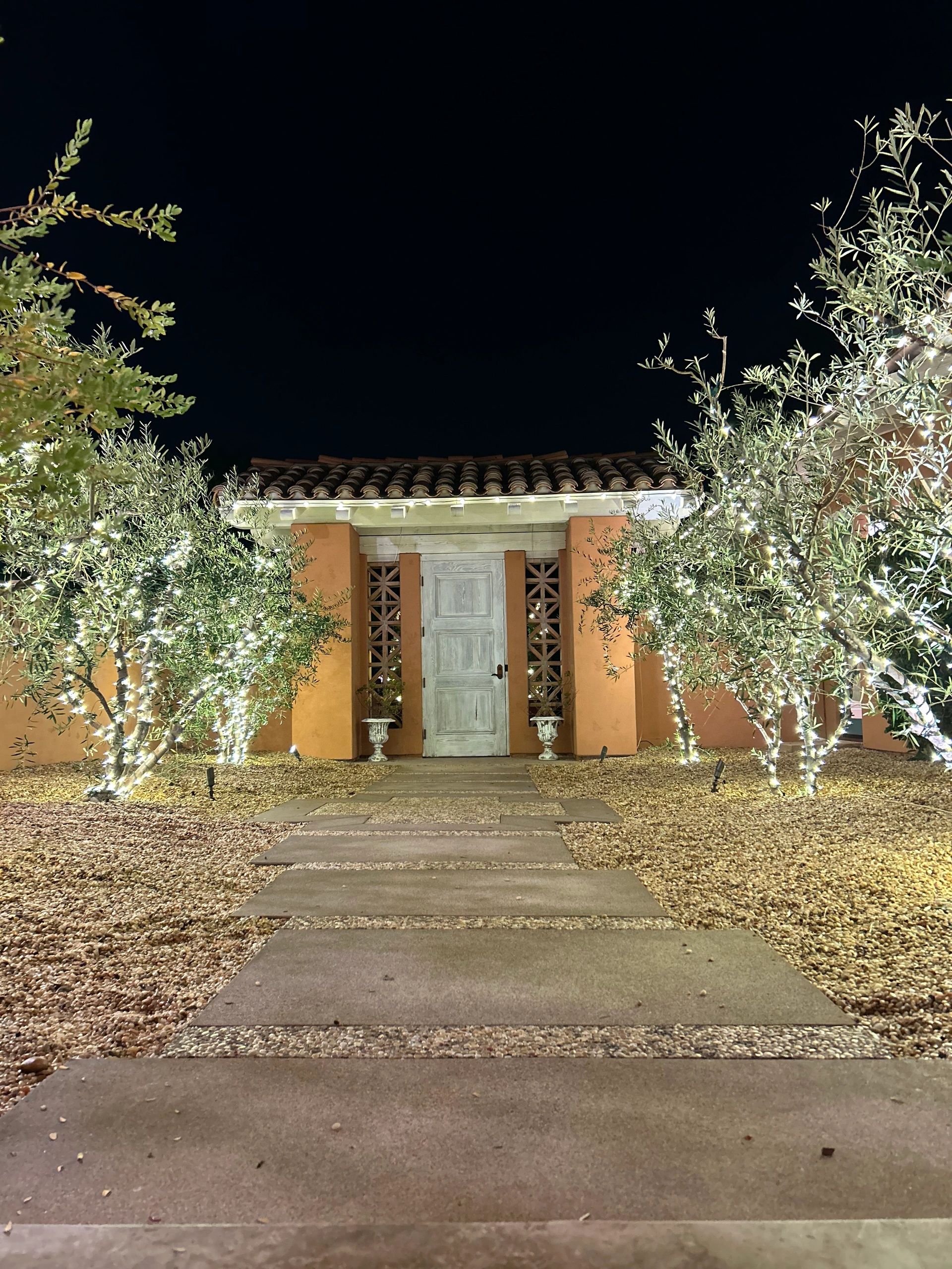 Holiday lighting installation on residential home