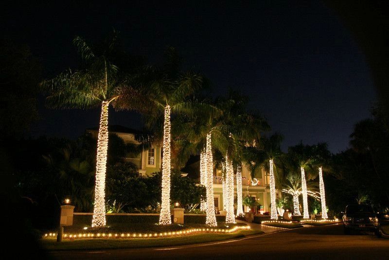 Luxury property with holiday lights at night